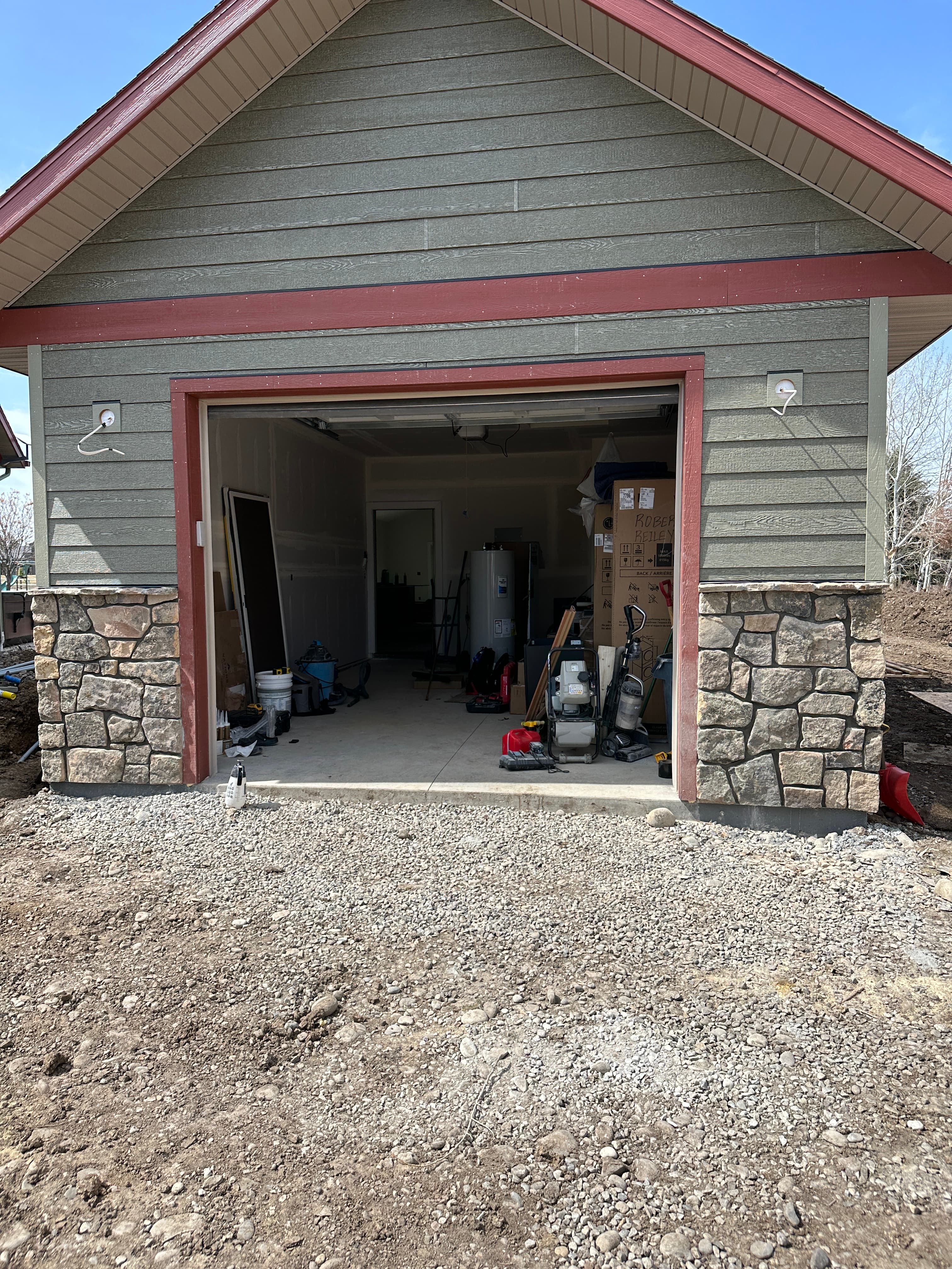 Stone columns flanking garage opening