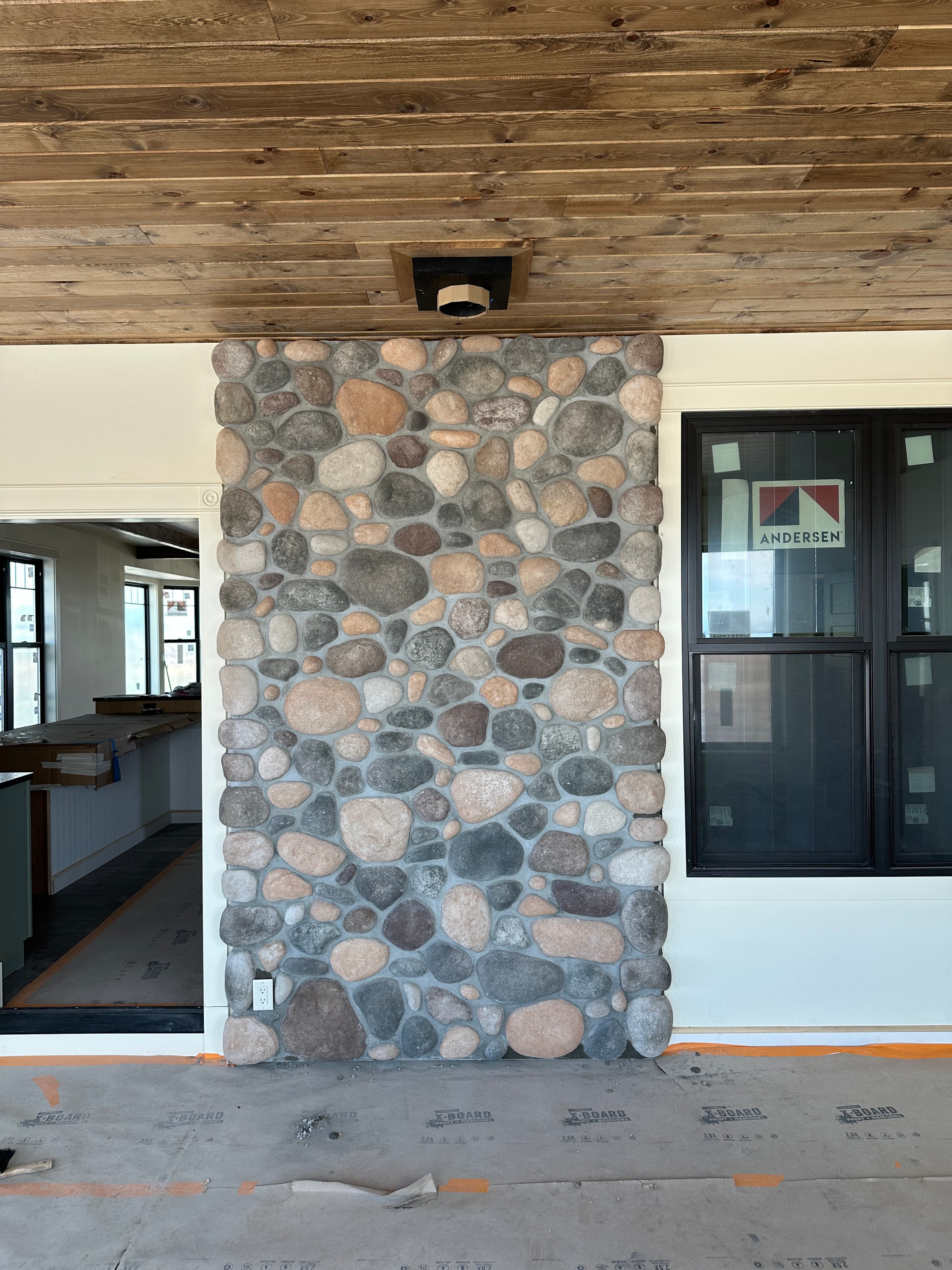 River rock interior accent wall