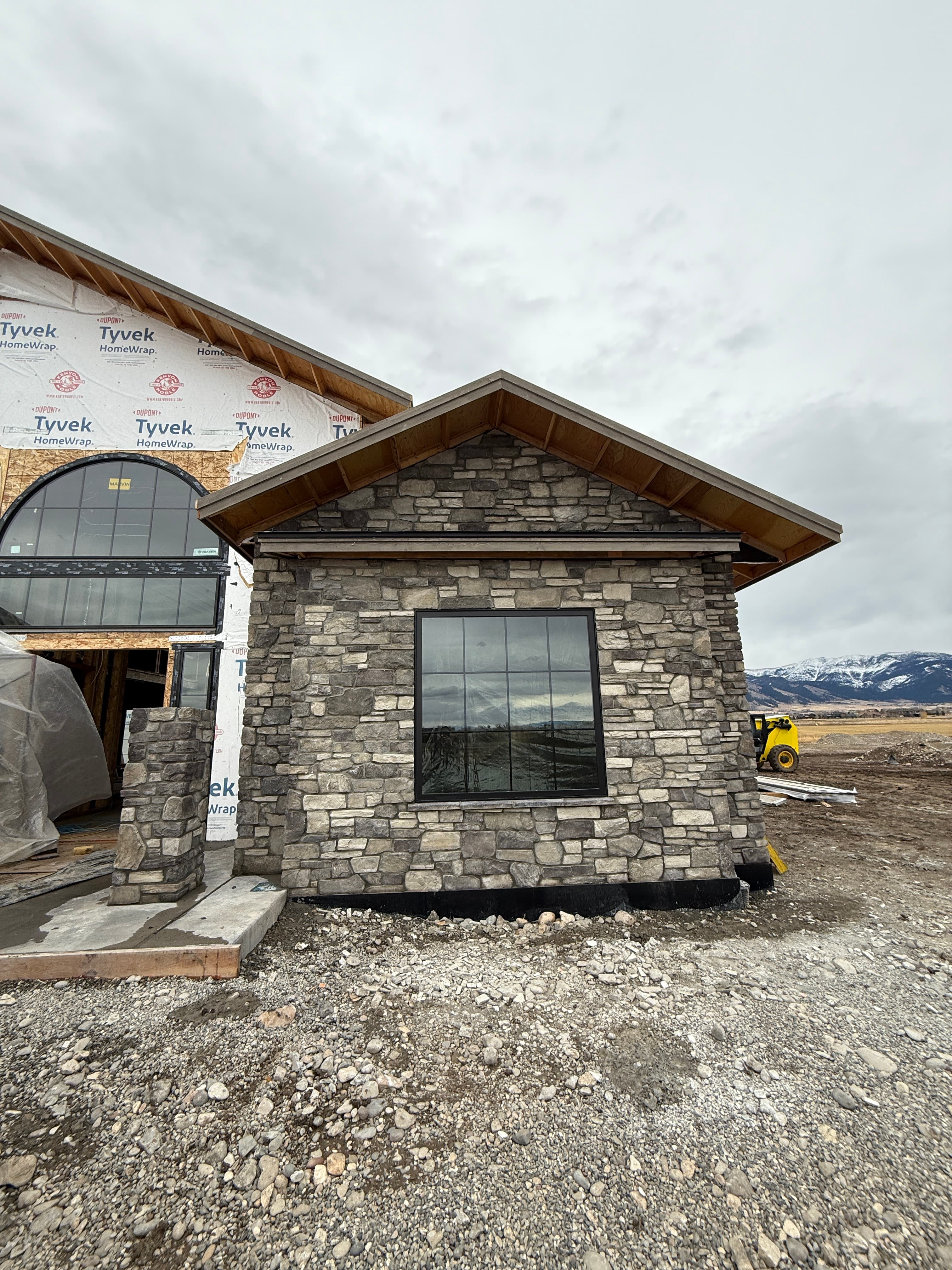 Gable end stone siding with mountains